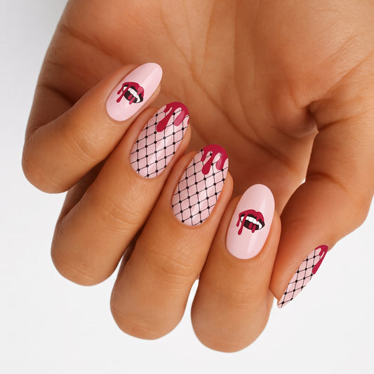 Pink semi-cured gel nail wraps with vampire lips, drip, and fishnet design.