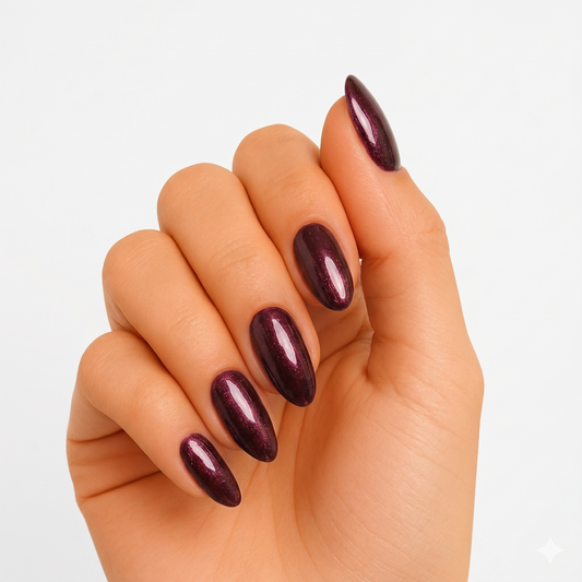 Deep burgundy shimmer semi-cured gel nail wraps on almond-shaped nails, glossy finish.
