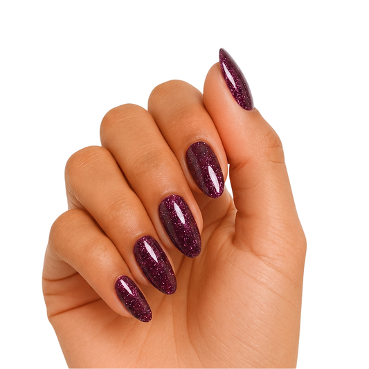Deep plum-purple glitter semi-cured gel nail wraps on almond-shaped nails.