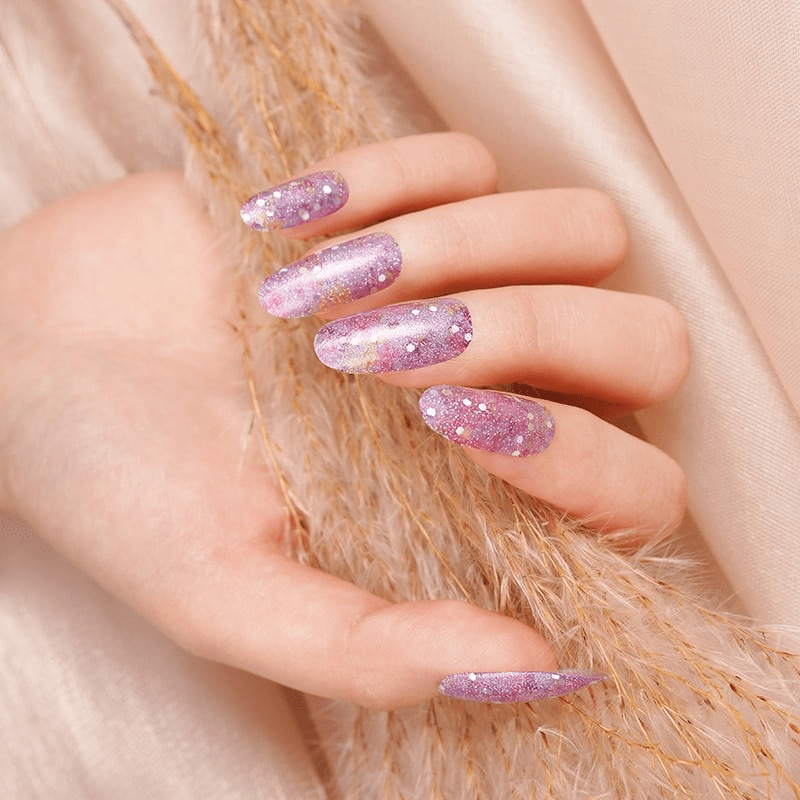 Pink purple glitter gradient gel nail wraps on hand showing sparkly finish