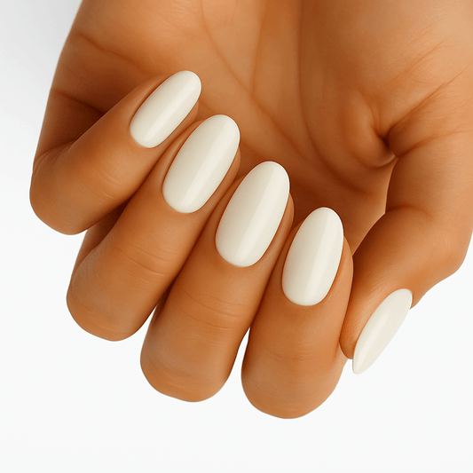 White pearl finish nail wraps on hand showing elegant oval manicure for bridal look