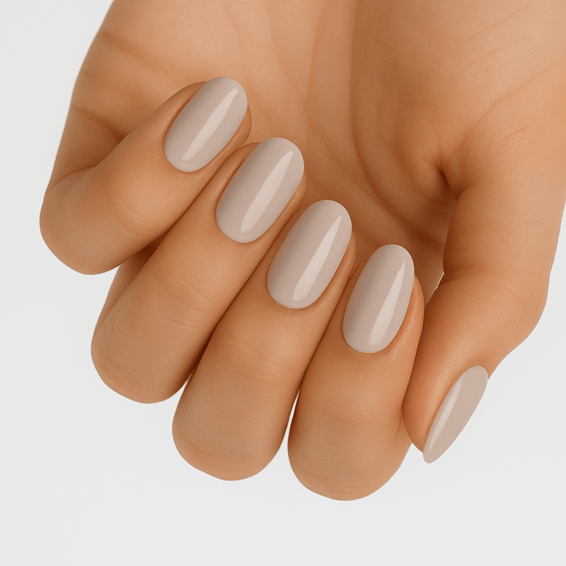 Beige nude gel nail wraps on hand showing natural minimalist manicure finish