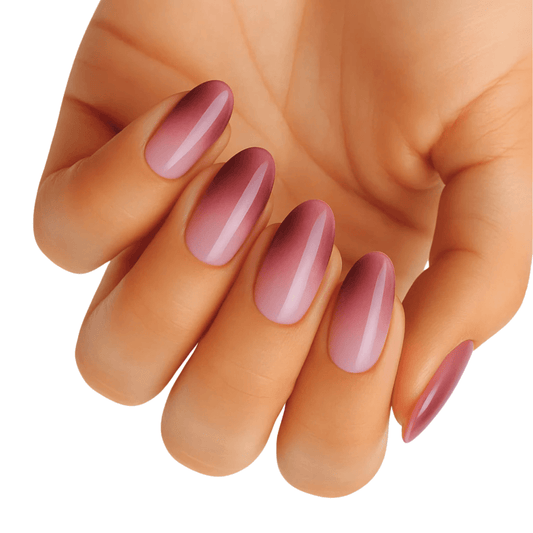 Dusty rose pink ombre gel nail wraps on hand elegant gradient manicure