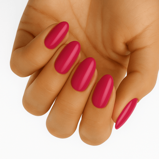 Hot pink glossy gel nail wraps applied on hand showing vibrant fuchsia manicure