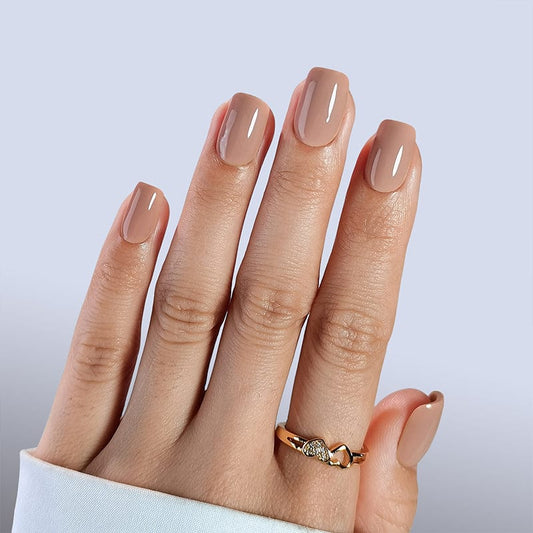 Glossy cappuccino brown press-on nails on hand showing short square gel nail extensions