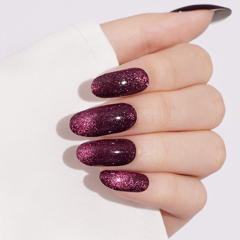 Deep magenta glitter press-on nails, glossy sparkle finish, coffin shape