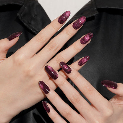 Deep burgundy glitter press-on nails with high-shine finish on coffin-shaped tips