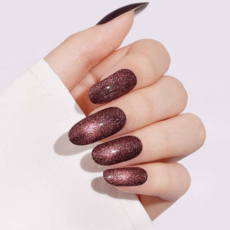 Deep red glitter almond press-on nails with sparkling shimmer finish