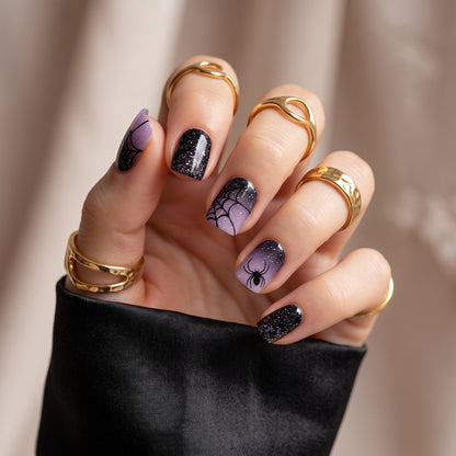 Purple and black glitter press-on nails with spiderweb and spider Halloween design