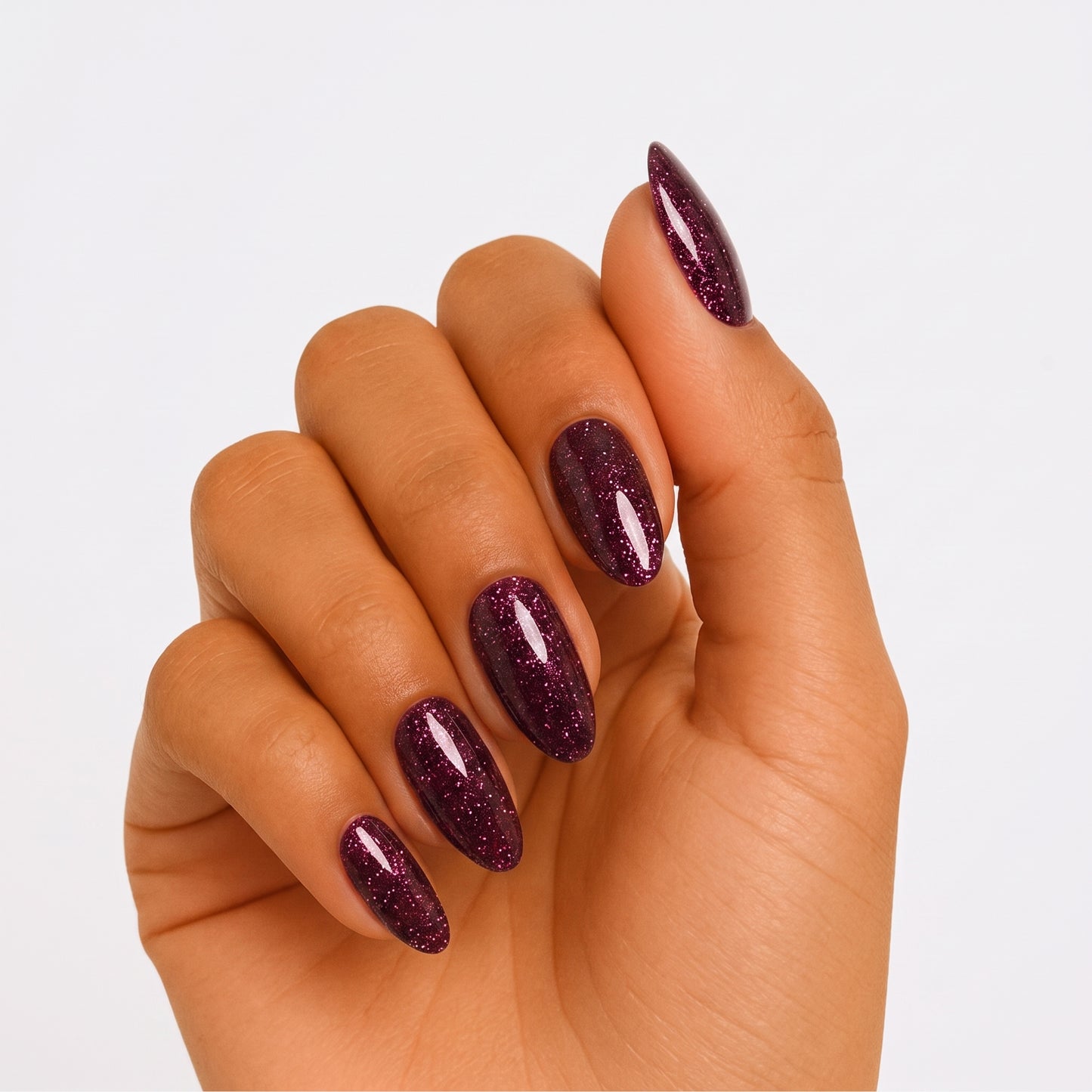Deep purple-red glitter semi-cured gel nail wraps on almond-shaped nails, glossy finish.