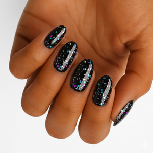 Black glossy press-on nails with multicolor confetti glitter dots, oval shape