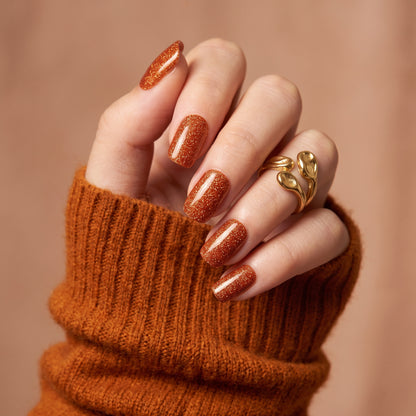 Rust orange shimmer semi-cured gel nail wraps on short square nails