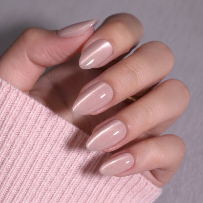 Sheer nude pink almond nails with subtle shimmer, glossy semi-cured gel finish.