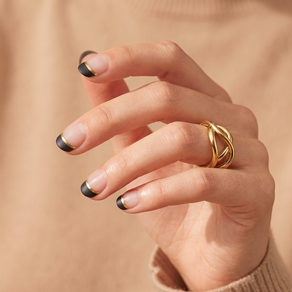 Semi-cured gel nail wraps with matte black French tips and thin gold line accent