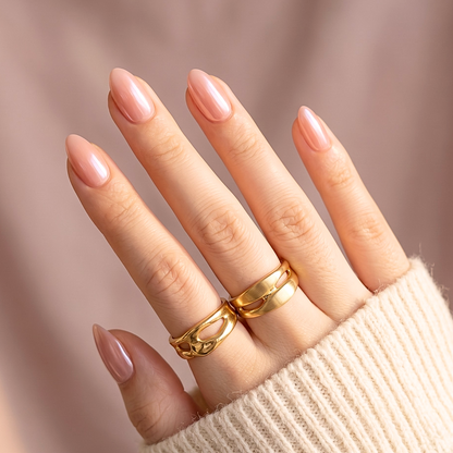 Sheer nude pink semi-cured gel nail wraps with glossy finish on almond-shaped nails.