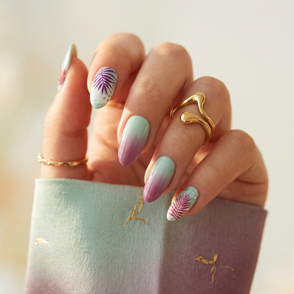 Mint-to-mauve ombré press-on nails with purple palm leaf accent design.