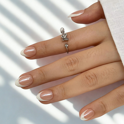 Glossy nude nail wraps with off-white diagonal French tip design