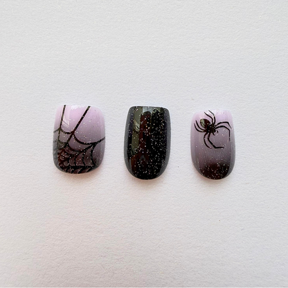Press-on nails with black glitter ombré, spiderweb and spider Halloween design