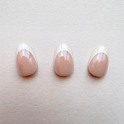 Glossy press-on nails, nude pink base with white diagonal French tips