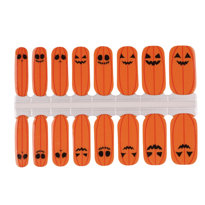 Orange semi-cured gel nail wraps with jack-o'-lantern pumpkin face Halloween designs