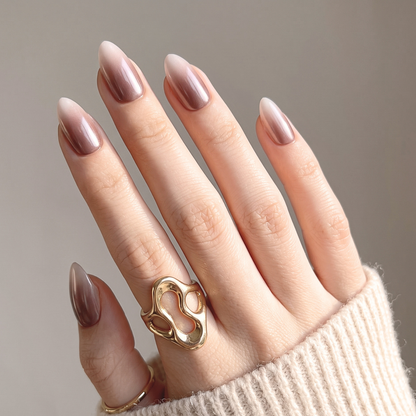 Almond press-on nails with mauve-brown chrome ombré fading to sheer nude tips