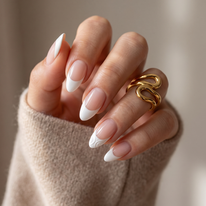 Glossy white French tip semi-cured gel nail wraps on nude almond-shaped nails.