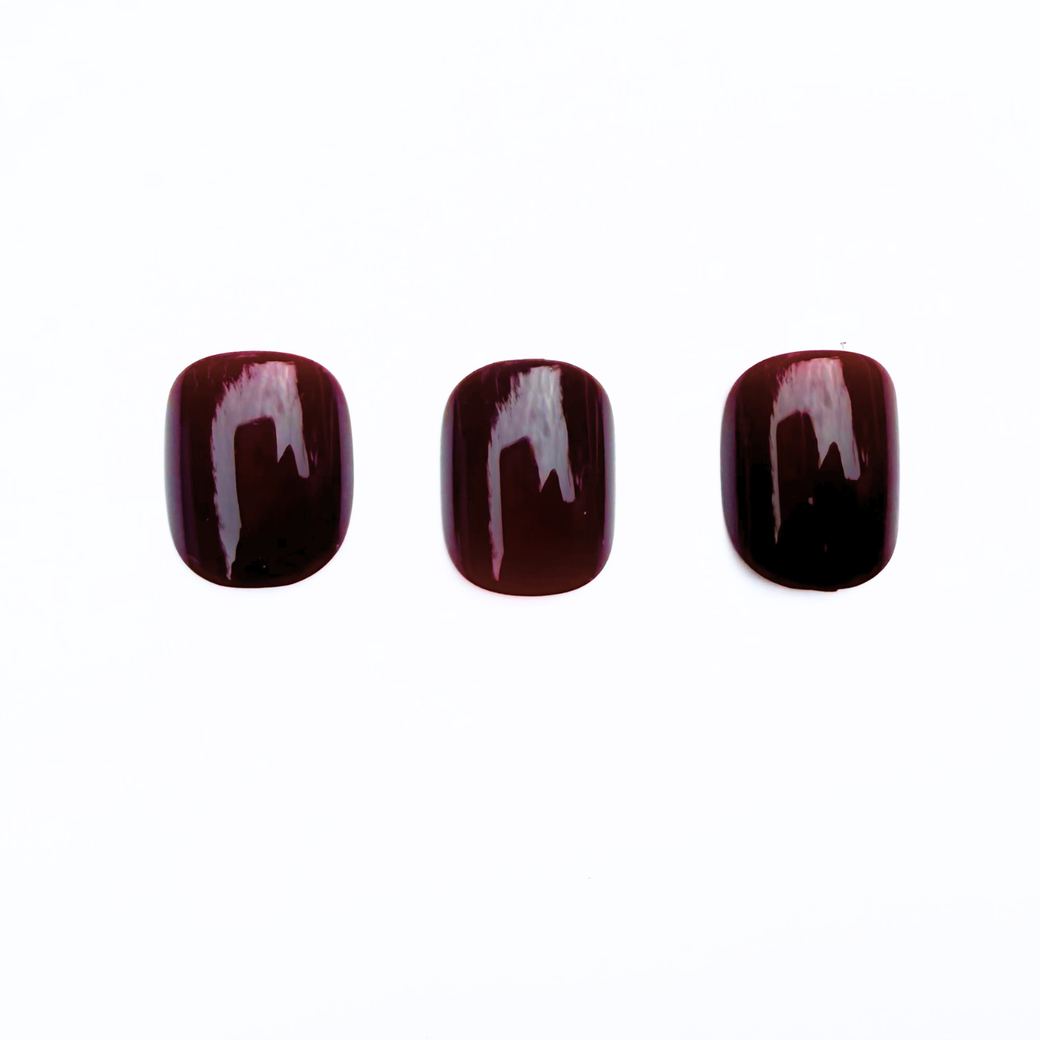 Deep burgundy glossy press-on nails, semi-cured gel, solid dark wine shade.