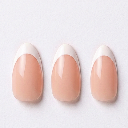 Glossy nude press-on nails with classic white French tips, almond shape