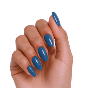 Solid slate blue glossy nail wraps in an almond shape, high-shine finish