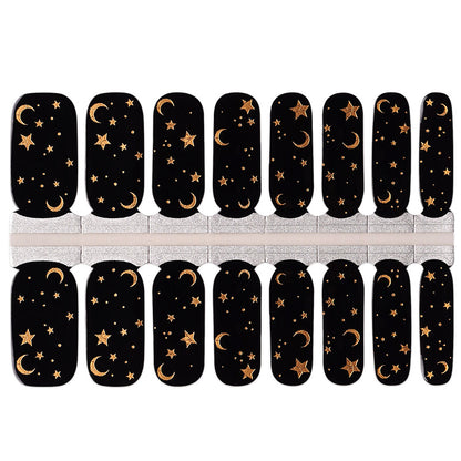 Black semi-cured gel nail wraps with gold moon and star celestial night sky design