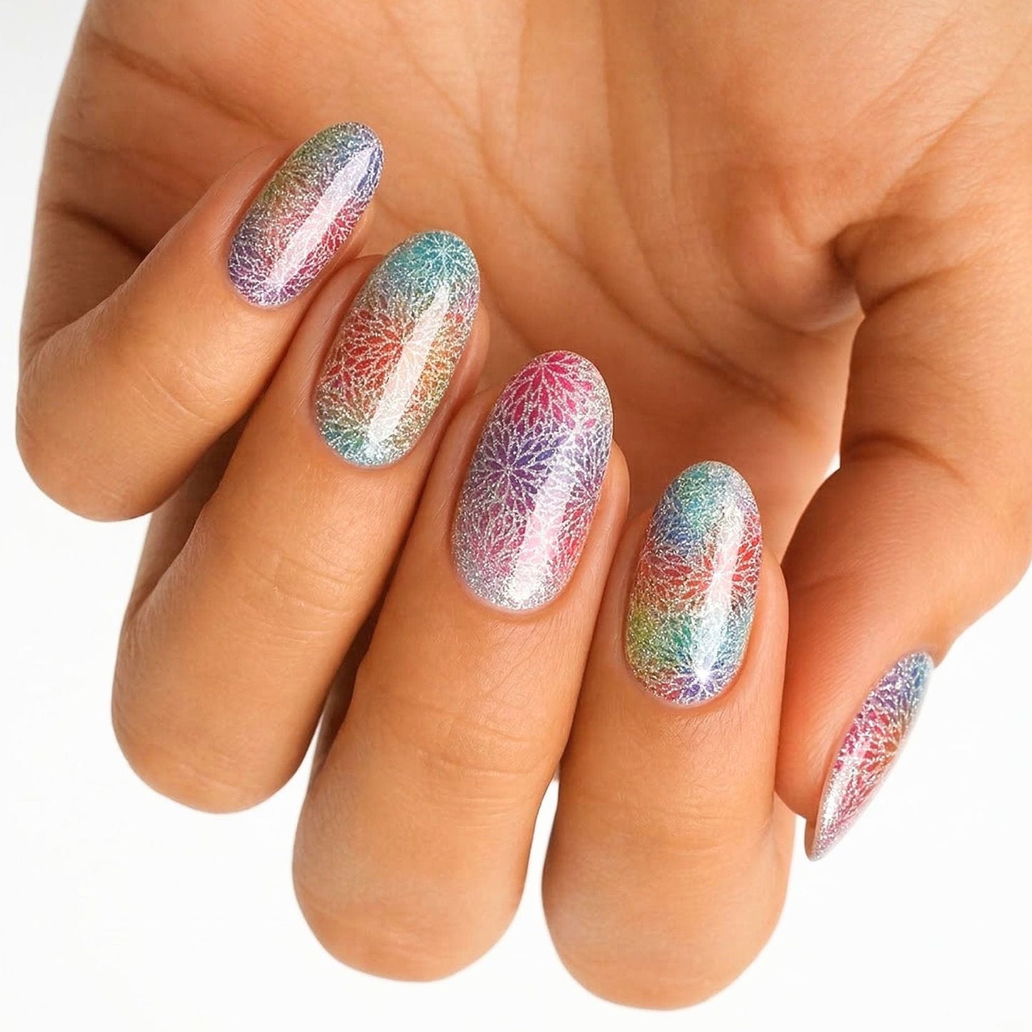Rainbow holographic gel nail wraps on hand showing multicoloured glitter finish manicure