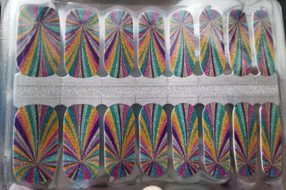 Holographic rainbow nail wraps sheet showing vibrant multicoloured sunburst pattern gel nail wrap strips