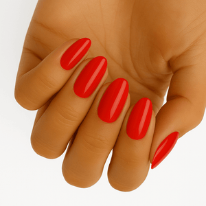 Glossy cherry red gel nail wraps applied on hand showing classic manicure finish