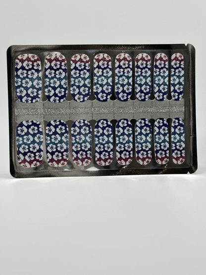 Non-UV nail wraps sheet showing purple floral hibiscus pattern with gradient sunset colours