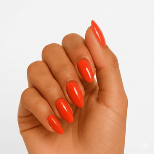 Bright red glossy gel nail wraps on hand showing vibrant orange-red manicure finish