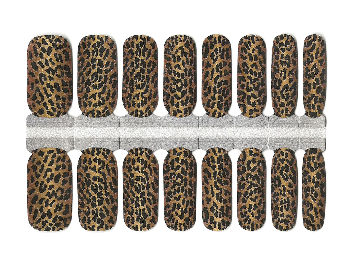 Brown and black leopard print nail wraps with a bold animal print design