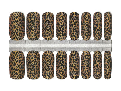 Brown and black leopard print nail wraps with a bold animal print design